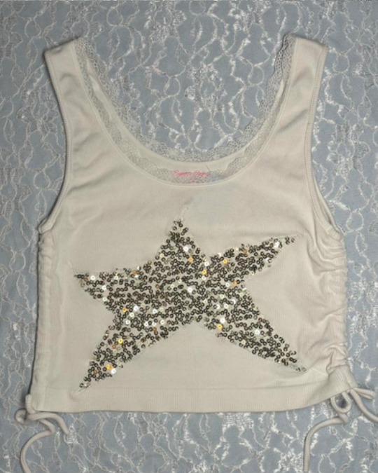 One-of-a-kind upcycled tank top from Disueños, handmade from secondhand fabric with a sequin star applique